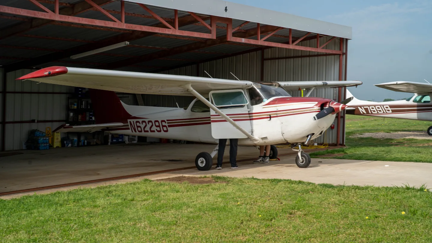 Training aircraft lined up outside the In The Pattern hangar