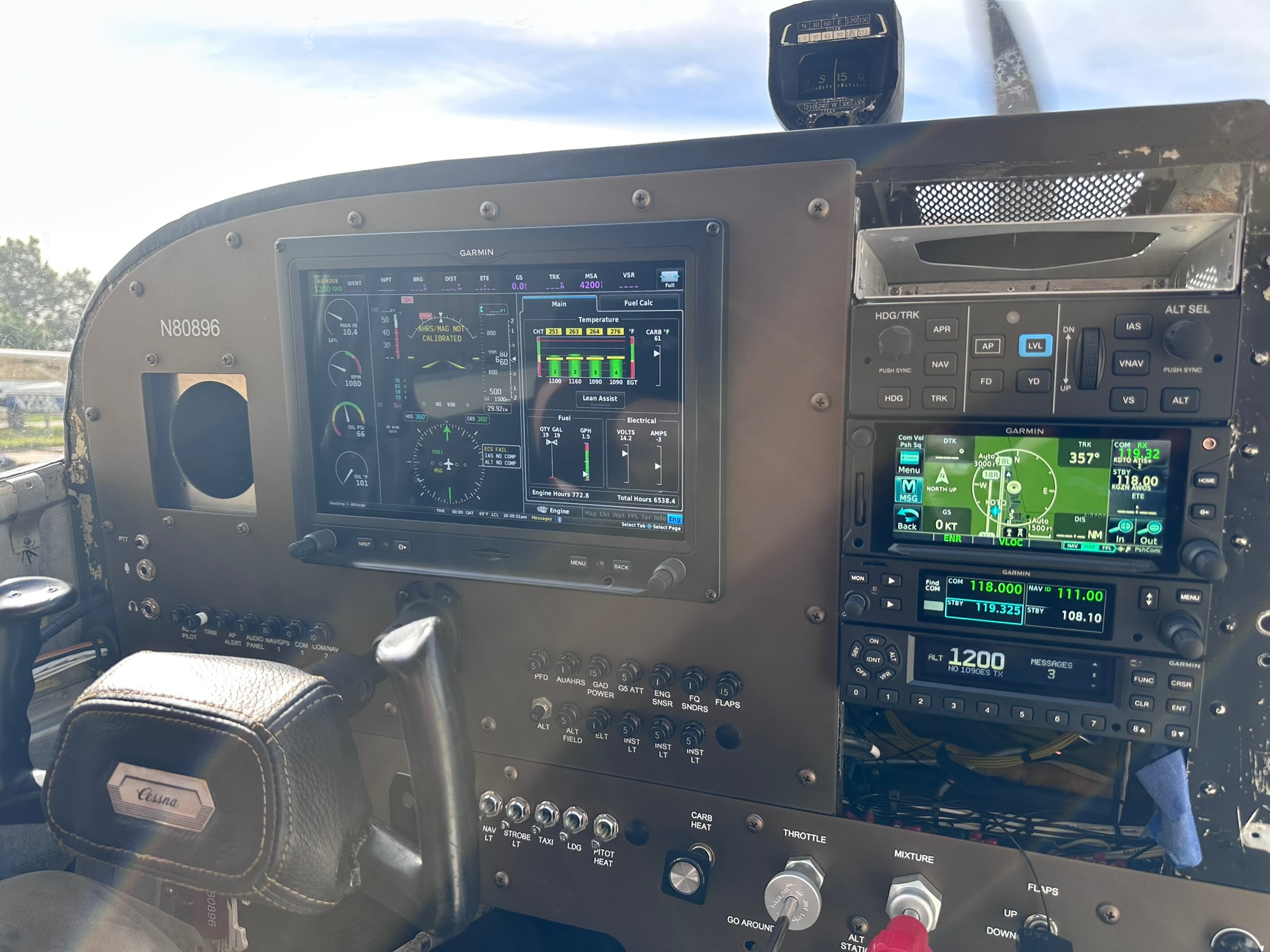 Flight instruments and navigation displays in an aircraft cockpit.