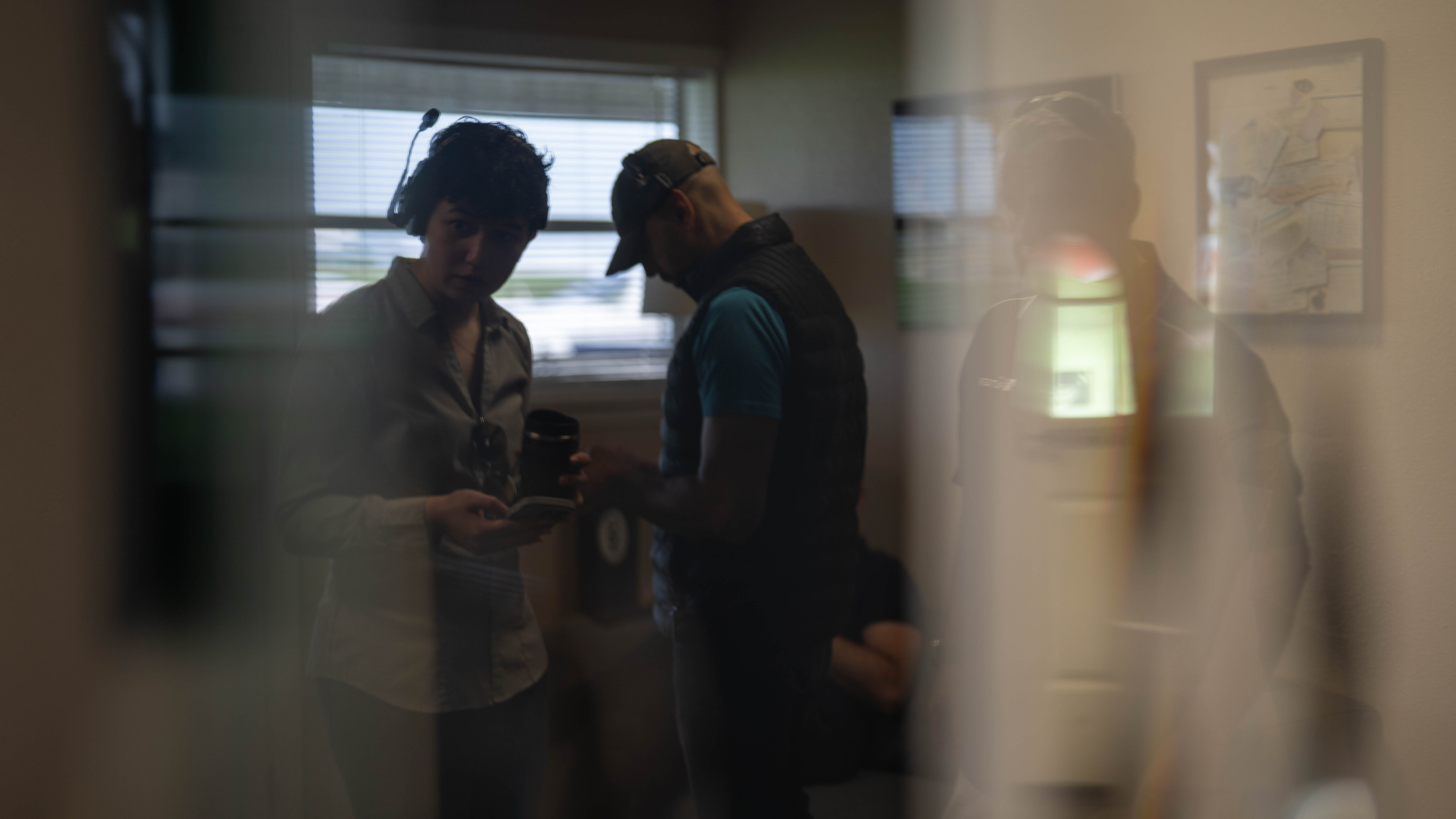 People sharing a conversation inside the flight school.