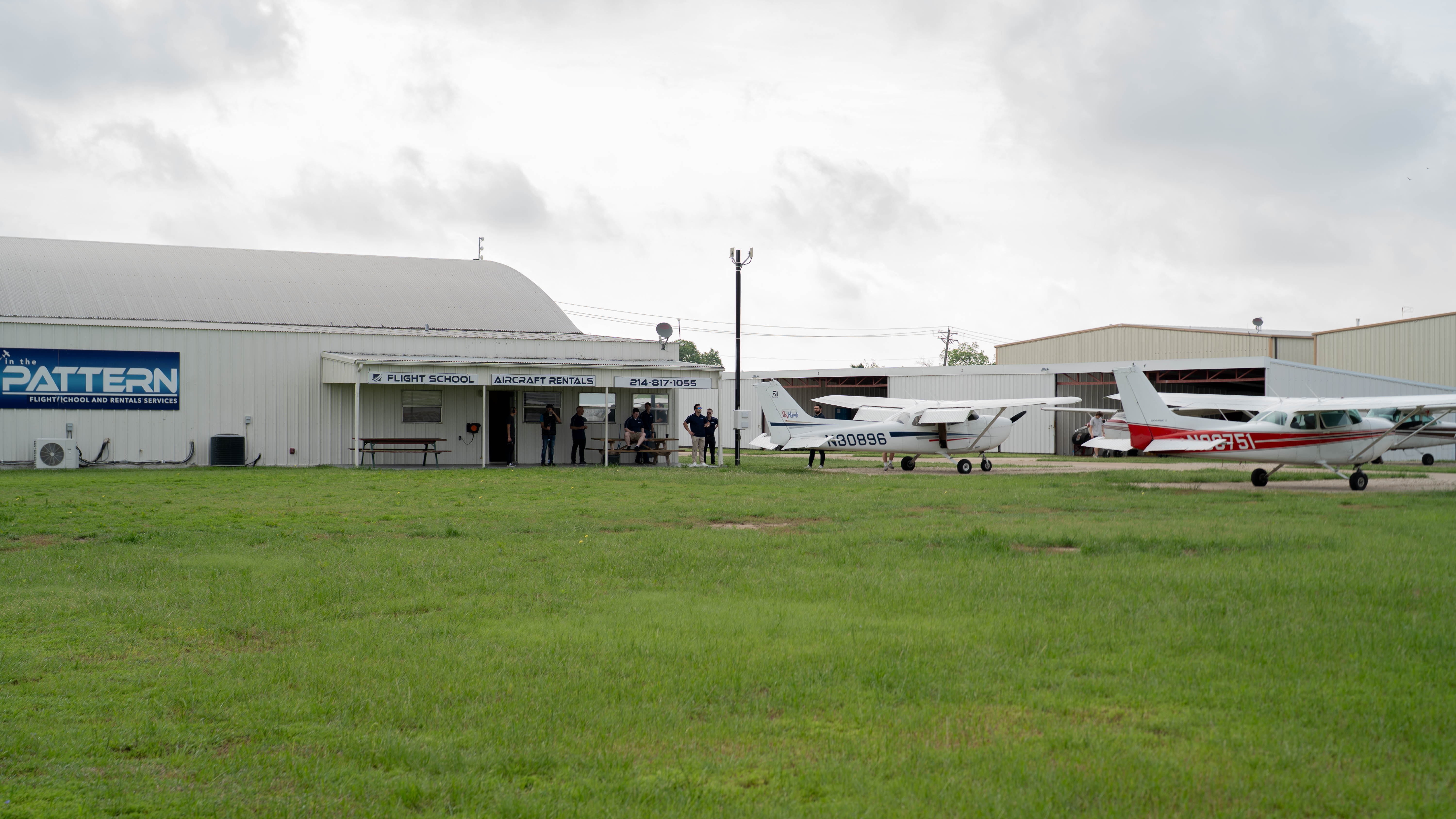The In The Pattern flight school building and aircraft.