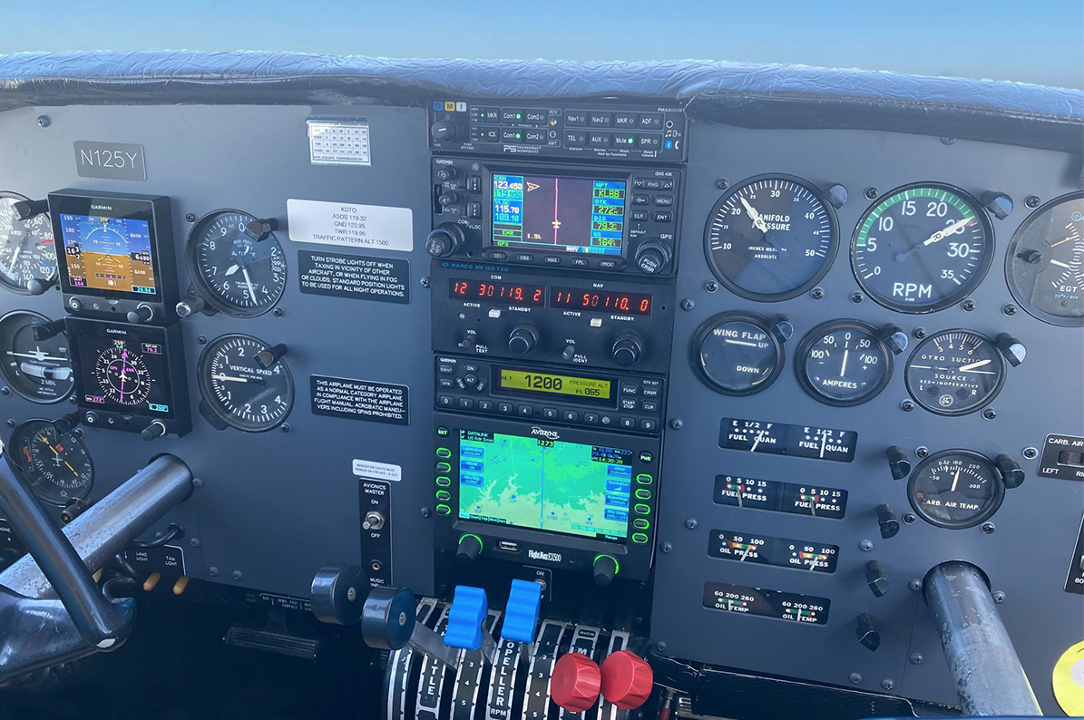Aztec twin-engine instrument panel and paired engine controls.